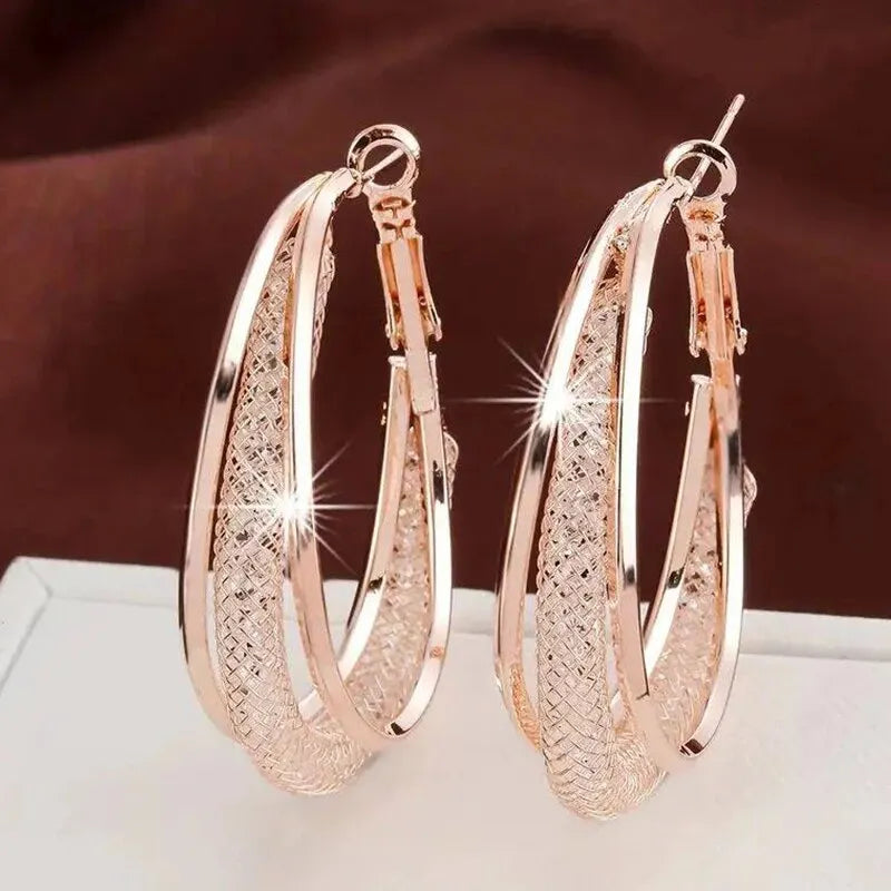 ✨ Twist & Spark Gold Hoop Earrings