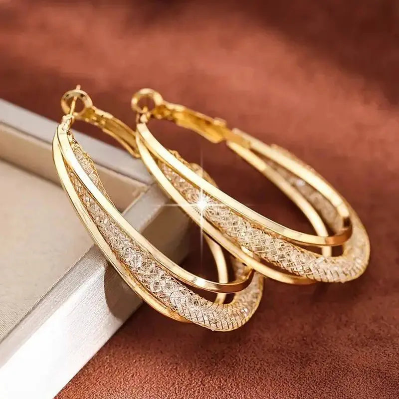 ✨ Twist & Spark Gold Hoop Earrings